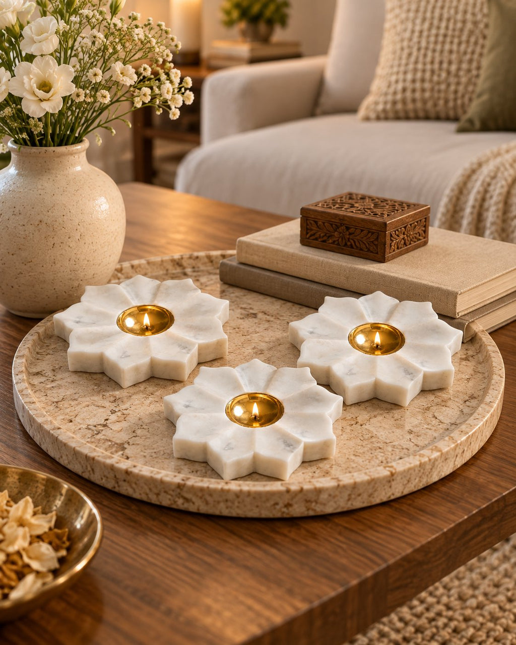Marble pooja diya styled with marigolds