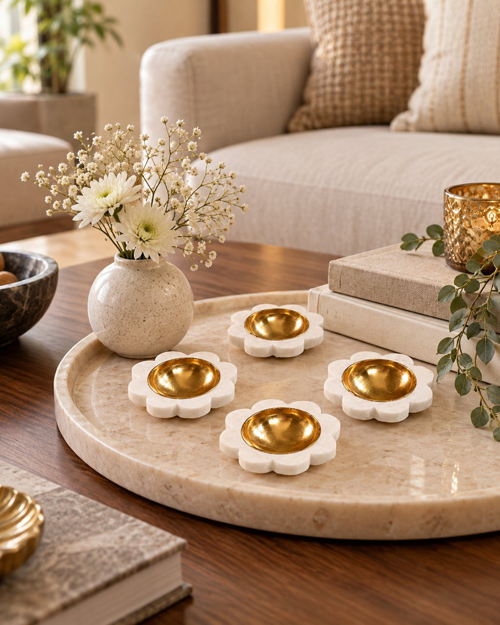 Marble tealight diyas on a mandir shelf