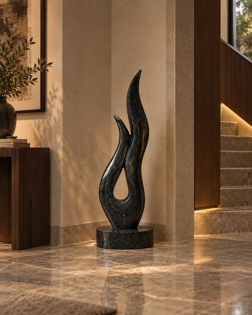 Marine Black marble flame sculpture in an entrance hall