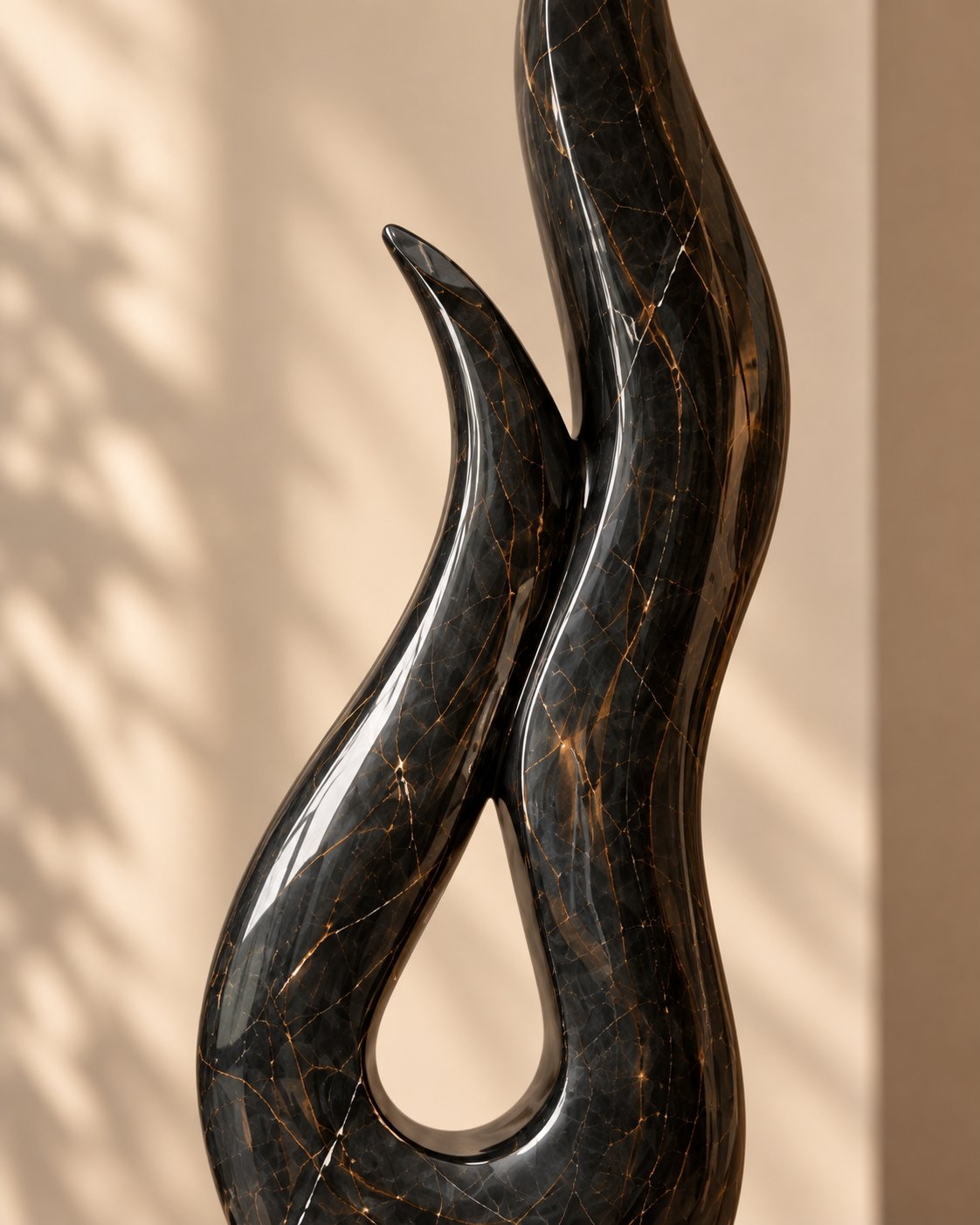Black marble sculpture on contrasting stone base
