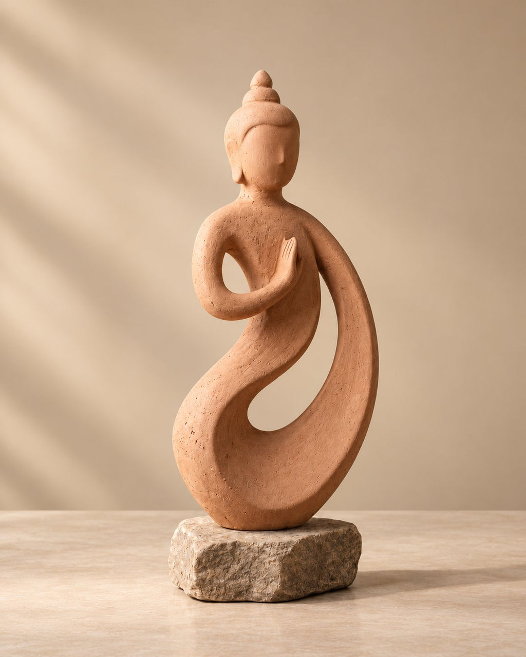 Carved stone figure styled on a sideboard
