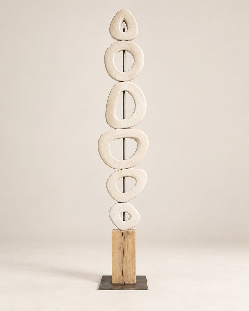 Tall white marble sculpture in a narrow entryway
