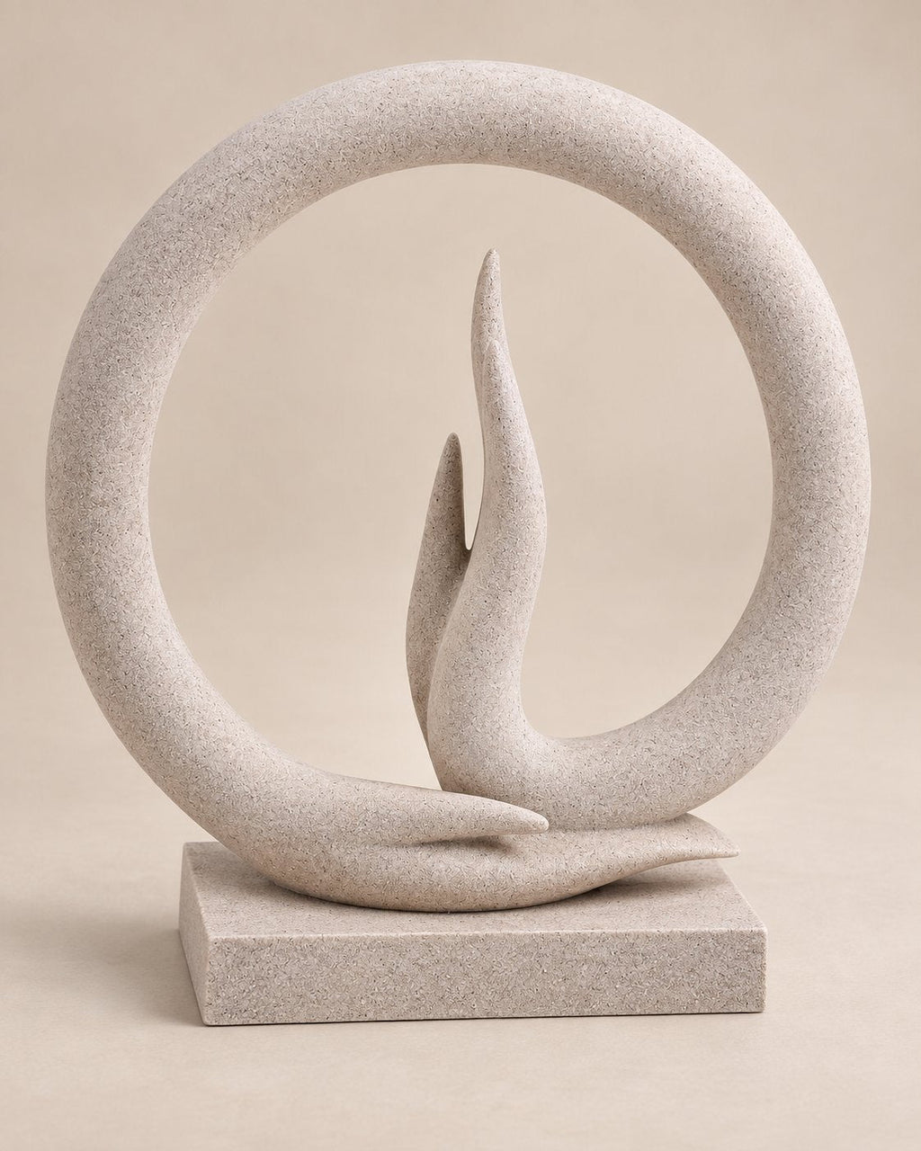 Carved marble ring enclosing a flame form